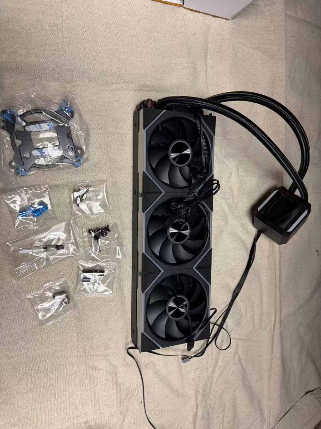 HotBell HB3XCF1 black 360mm liquid CPU cooler kit with triple-fan radiator, display pump, tubing, and mounting hardware