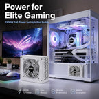 HotBell 1300W power supply displayed beside a white high-end gaming PC with RGB cooling and dual monitors