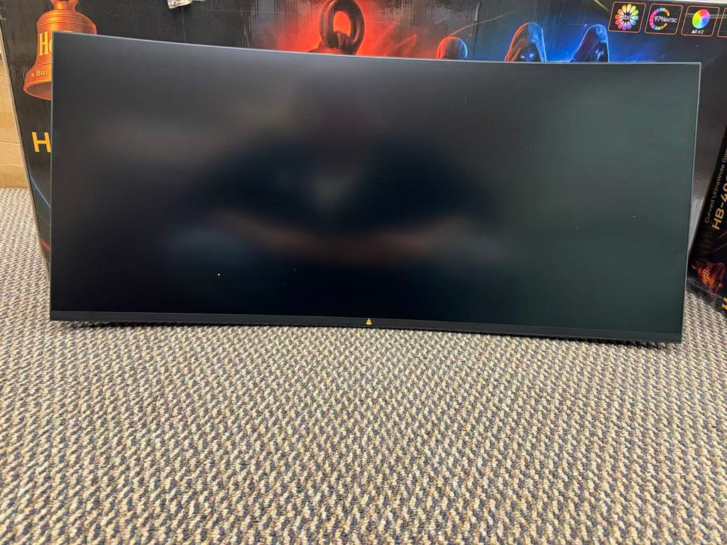 HotBell 40-inch curved gaming monitor with blank screen displayed in front of its retail packaging